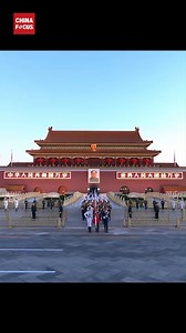 A flag-raising ceremony takes place at Tiananmen Square in Beijing to mark the 75th anniversary of the founding of the People's Republic of China. The first rays of dawn spread across the nation as the magnificent five-starred red flag rises to the powerful national anthem. | China Focus