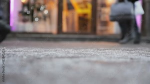 People Go On the Road. For captions. Legs of people pass by on the background of cafe