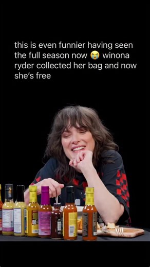 memes & movie clips on Instagram: "she used to be the main character in season 1😭 🍿: Winona Ryder appeared on Hot Ones in a widely-shared episode released in late November 2025, where she took on the show’s trademark spicy challenge while sitting down with host Sean Evans. During the taping she opted for spicy fried tofu cubes instead of traditional chicken wings, tackling the heat with a spoonful of ice cream between bites to cope with the spice. Ryder opened up about her extensive first-edit
