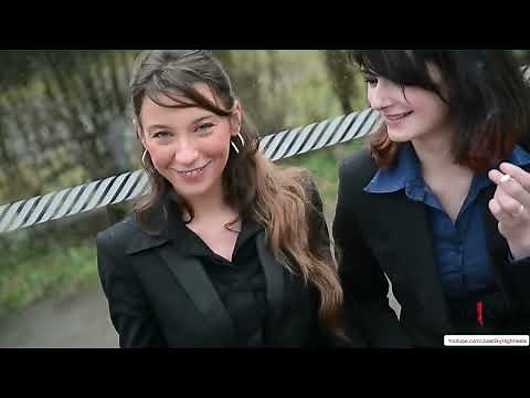 Confident Women in Skirt Suits Brave the Rain! 🌧️ Style, High Heels & Flirty Moments at the Bus Stop