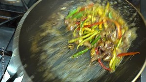 Pan of liver. Cooking beef liver covered in flour on a frying pan. Pieces of fried beef liver in frying pan. Video.