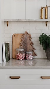 Easy, affordable holiday kitchen decor Give me 30 seconds, a few glass canisters, and some festive treats… and suddenly the kitchen feels like Christmas 🎄✨ Fill them with mini candy canes, white chocolate kisses — or anything you love. They’re under $7 and double as the cutest hostess gift idea (just add a ribbon!). Paired with this $20 Christmas tree board, it’s such an easy, affordable way to bring a little holiday magic to your kitchen. ✨ Comment SHOP for links, save this idea for later, and