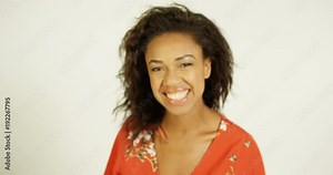 4K Beautiful mixed race model smiling & laughing in studio photoshoot