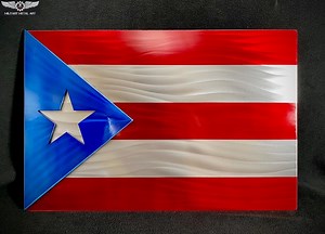 Meaning Of The Puerto Rican Flag: 🇵🇷 The Puerto Rican flag consists of 5 alternate red and white stripes. On the left of the flag is a single white five-pointed star resting in a blue triangle. The three red stripes symbolizes the blood from the brave warriors, the two white stripes victory and peace after obtaining independence, blue symbolizes the sky and sea and the white star is the island. In 1952 when Puerto Rico became a commonwealth, the flag was officially adopted, but it symbolism wa