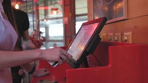 clip-1017004033-waitress-makes-order-kitchen-using-touch-computer