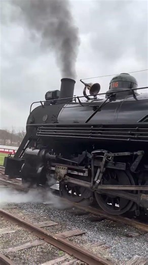 Steam locomotive 🚂 sounding its bell going in reve
