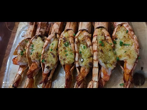 Butterfly prawns cooked in garlic butter and shrimp fat (Aligue)
