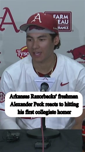 Arkansas Razorbacks freshman Alexander Peck reacts to hitting his first collegiate homer
