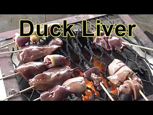 Duck heart and liver on a bamboo skewer, cooked over homemade charcoal