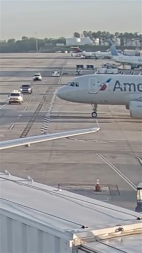 American Airlines pilot slams on breaks, nearly crashes into truck on tarmac #shorts