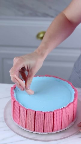 Sheri Wilson on Instagram: "Barbie Pool Cake Hack! 💗🌴 I tried remaking my Barbie Pool Cake using a grocery store cake and this made it so easy! Let me know if you’d like to see a longer breakdown of the process! You’ll need: -grocery store cake -strawberry wafer cookies -blue frosting -blue jello (prepared according to package directions) -barbie doll legs -pink donut -candy canes -sour rope -large drink umbrella (party city) -mini candy canes -chocolate decorations (molds from J
