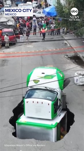 A soda delivery truck collapsed into a sinkhole in Mexico City on Saturday. The Jarritos-branded cargo truck sank rear-first into the sinkhole as residents looked on, its weight causing it to sink even further. No injuries were reported. https://abcnews.visitlink.me/VRM9ho | ABC News