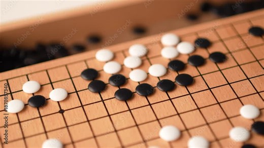 The traditional Japanese game of Go (Igo) improves concentration, creativity, strategic thinking, and respect for the opponent. 4K slow-motion video.