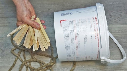 Old Bucket and Sticks Upcycled into Decor