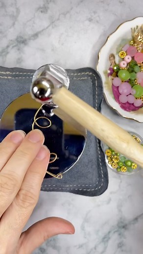 It’s never to early to think of spring! Scroll design bar necklace featuring gorgeous pink and green beads from Jesse James Beads #barnecklace #DIYGifts #HolidayGiftIdeas #HandmadeForTheHolidays #hammeredjewelry #StatementJewelry #brandpartner | Awanderinggypsyco