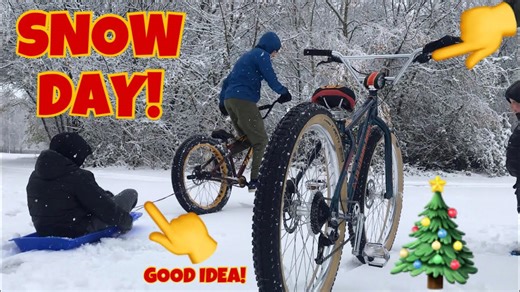 Riders perform wheelies despite snowy weather conditions