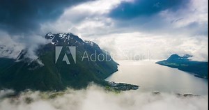 4K Norway Mountains And Landscape View - Clouds Time Lapse Tilt Down. Andalsnes, Rauma, Norway