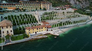Limone Town in Italy on the Lake Garda, beautiful mountain views, old town red roofs, green lake.