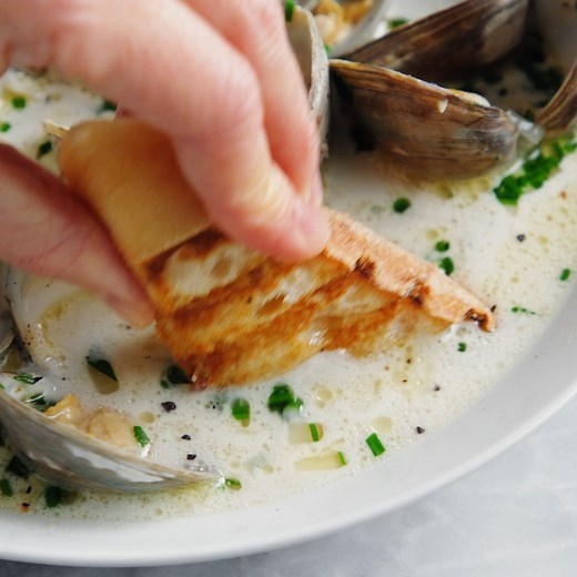 Garlic Butter Clams with White Wine Cream Sauce - The BEST steamed clams ever! So garlicky and buttery, served with a heavenly cream sauce! RECIPE: https://damndelicious.net/2021/02/15/garlic-butter-clams-with-white-wine-cream-sauce/ | Damn Delicious