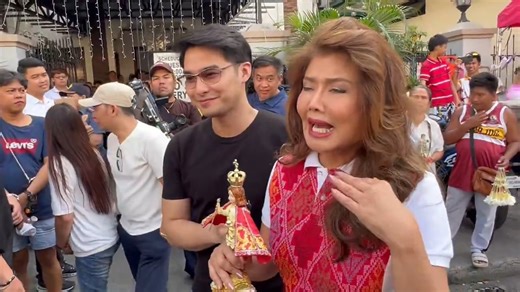 Senator Imee Marcos arrives at the Minor Basilica and Archdiocesan Shrine Parish of Santo Niño De Tondo in Manila for the Feast of the Santo Niño. She was welcomed by actor McCoy De Leon. | via Lyza Aquino, ABS-CBN News | ABS-CBN News