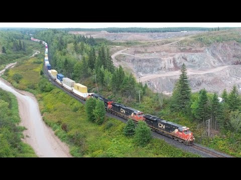 Awesome Aerial View! Big Stack Train CN 120 Passing Rock Quarry near Memramcook, NB at Track Speed