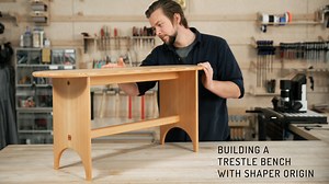 The full roundover profiles and wedged through tenons of this bench let the endgrain shine and reward careful stock selection! Origin Workstation make easy and accurate work of the trestle arches, seat profile, and perfectly wedged mortises, but you can make this bench with conventional shop tools as well. Visit shapertools.com/trestlebench to get free downloadable plans for this project, both with and without Origin Workstation. | Shaper