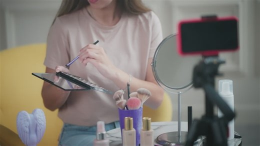 Girl blogger makes social media video on makeup and beauty products - Free Stock Video