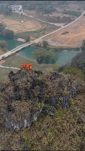 2.3K views · 134 reactions | Firefighters participated in a fire drill in mountainous areas in south China's Yangshuo County. They rode a zip line over 70 meters in the sky to practice handling potential wildfire situations. #AmazingChina | China Xinhua News | Facebook
