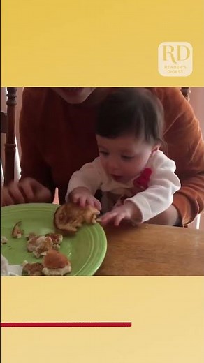 Hungry baby learns she loves pancakes!