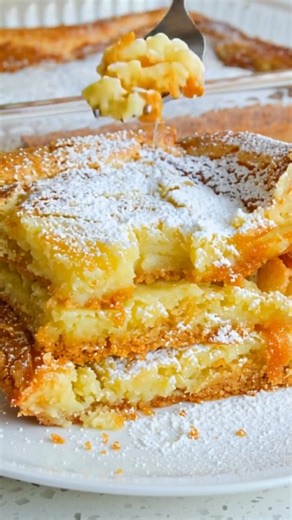 This family-friendly Gooey Butter Cake has seven ingredients and takes less than 10 minutes to get in the oven. It is so popular at potlucks and family reunions that is usually the first dessert gone. | Quick and Easy Recipes