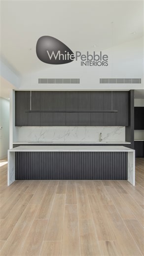 This kitchen was designed with intention — every line, every finish, every function carefully considered to create a space that’s not just beautiful, but deeply liveable. The dark joinery anchors the space with warmth and strength, while the veined porcelain benchtops and splashback bring contrast and refinement without feeling precious. Flush cabinetry and integrated appliances maintain a clean, uninterrupted visual flow — because simplicity, when done well, is anything but plain. It’s a kitche