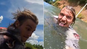 Influencer under fire for jumping into croc-infested river