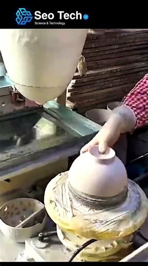 a pad printing machine being used to apply intricate patterns to ceramic bowls