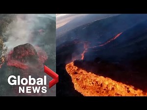 La Palma volcano: Drone sweeps over sizzling lava stream, huge molten boulder slides down side