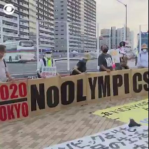 Around 15 protesters gathered in downtown Tokyo on Friday to protest the Olympic Games and the International Olympic Committee because of a spike in coronavirus cases in the country. Shouting slogans like "No IOC, No Olympics" the protesters held up signs demanding the ongoing games be cancelled. | CBS News