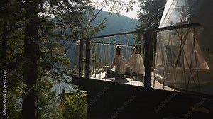 Partners sit in lotus pose against nature. Couple does everyday rituals for inner calmness rebooting during eco vacation. Connection with nature