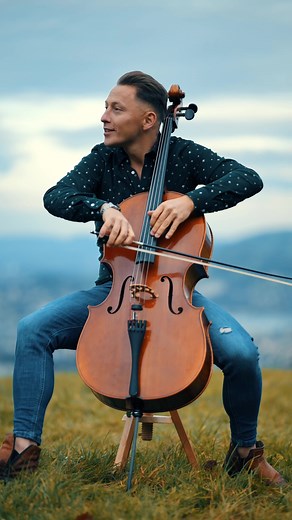 Outdoor Cello Performance in Scenic Landscape