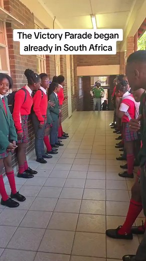 South African students welcome their Nigerian Teacher with a guard of honour, after Nigeria beat South Africa in the AFCON. #africanfolder | African Folder