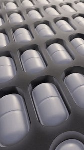 Pharmaceutical production of pills and drugs on manufacturing line. Looping animation