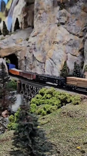 A short Southern Pacific freight train goes over South Boulder Creek