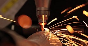 CNC Laser cutting of metal, modern industrial technology Making Industrial Details. The laser optics and CNC (computer numerical control) are used to direct the material or the laser beam generated.