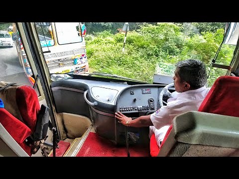 Multi Axle Volvo Bus Meets heavy load Lorry at a Tight Ghat section Turn