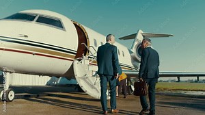 Mixed ethnicity VIP Businessmen boarding private jet