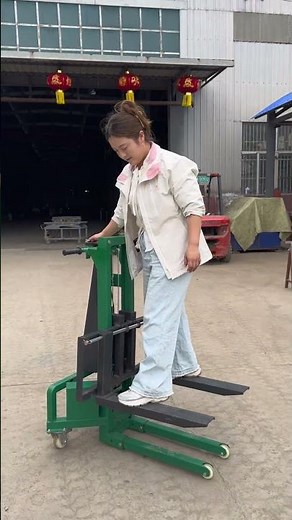A compact forklift with adjustable-width forks. Maneuverable, portable, and handles 300kg with ease.