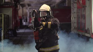 firefighter portrait wearing full equipment, oxygen mask, and emergency rescue equipment, hydraulic clamps, smoke and fire trucks in the background.