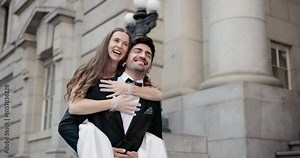 Couple, piggyback and marriage at city hall with laughing, commitment and wedding celebration outdoor. Civil union, people and walking by courthouse for ceremony, relationship or groom carrying bride