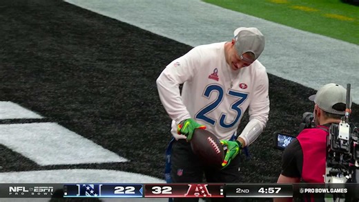 CMC poses with the football for a two-point conversion