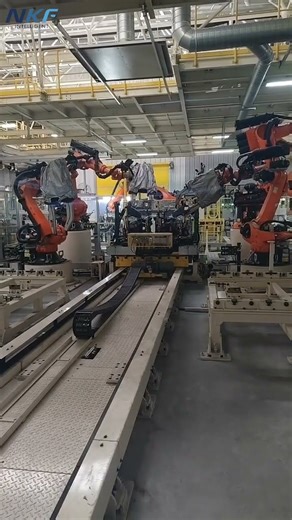 Demonstration of our track supporting KUKA robots applied to automated handling and spot welding.
