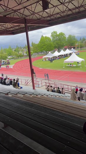 Outdoor Track and Field Spectators Enjoying the Event