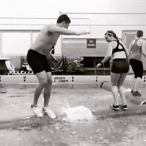 The dynamics in a log rolling bucking match are intense! Watch in slo-mo as Cassidy Scheer attempts to kick Abby Hoeschler off the backside of the Key Log®. Keep an eye on his outside, dominant foot to see the kick. When the timing is right, a well executed kick can buckle an opponent's knees causing them to fall. In this case, Abby's resistance caused Cassidy's kick to affect him more than her. Watch as his shoulder's rear back. He does a great job of recovering using his core muscles and quick